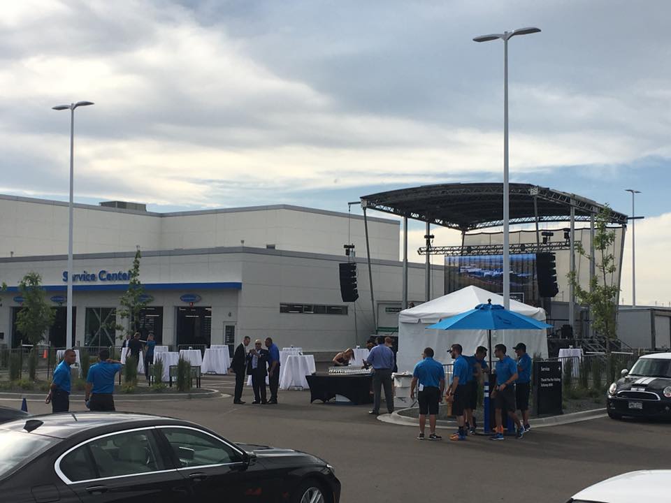 Summit Valet crew in blue polos running valet at a Colorado dealership event