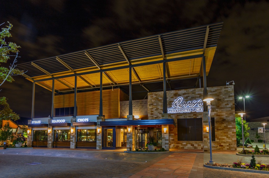 Upscale Denver-area dining and retail destination entrance at night